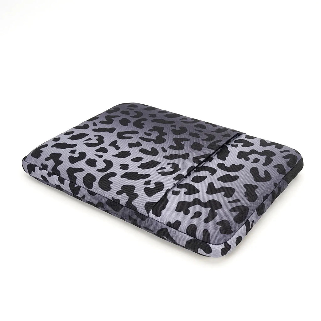 Leopard print laptop protective sleeve showing flannel interior and waterproof polyester exterior