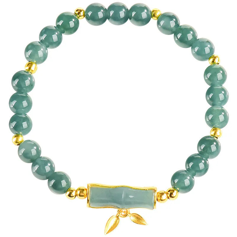 Blue water natural jade beads on a sterling silver high-rise bracelet for women.