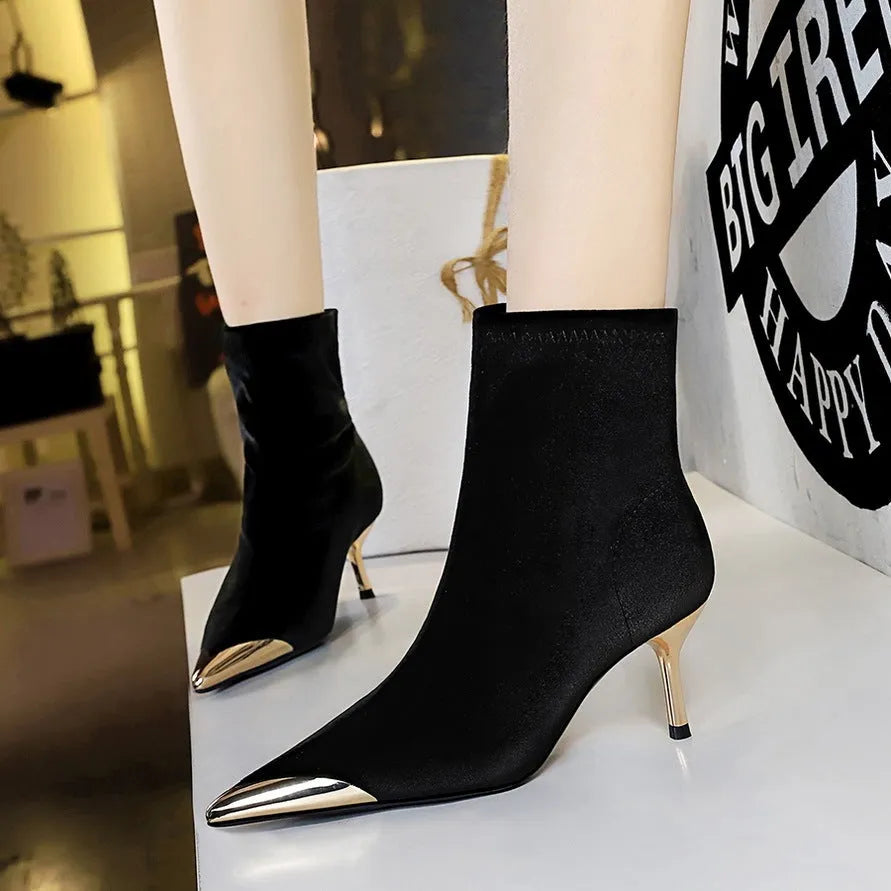 Women's suede stiletto heel ankle boots in black with pointed toe and metal detail