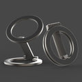 Multi-functional fastened ring metal desktop stand bracket black colour on desk holding smartphone upright