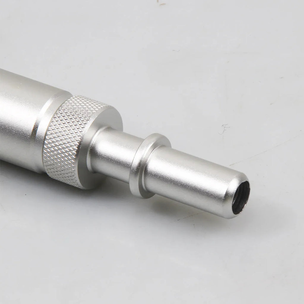 Silver metal VAS6262-9 transmission oil refueling adapter tool on a workshop bench.