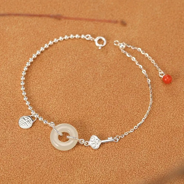 Women's Hetian jade bracelet in 925 silver with peace buckle charm, geometric Chinese style design