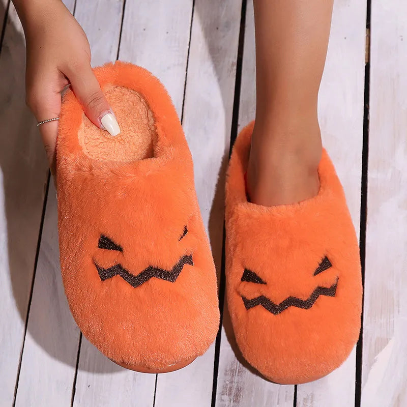 Orange Halloween pumpkin slippers with plush interior and non-slip PVC sole