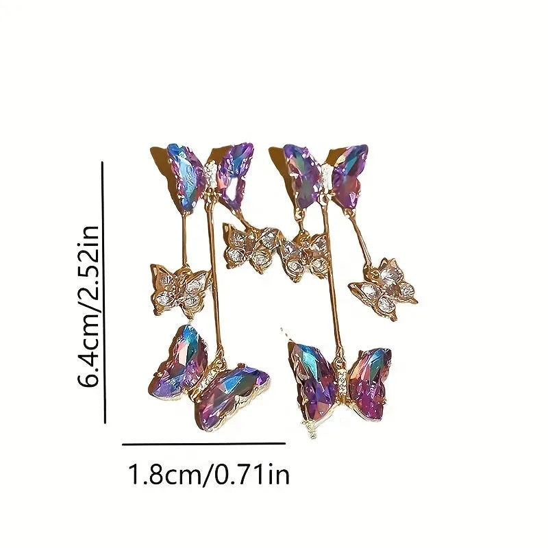 A pair of women's silver-plated alloy tassel drop earrings with crystal flowers in a blue purple butterfly colour.