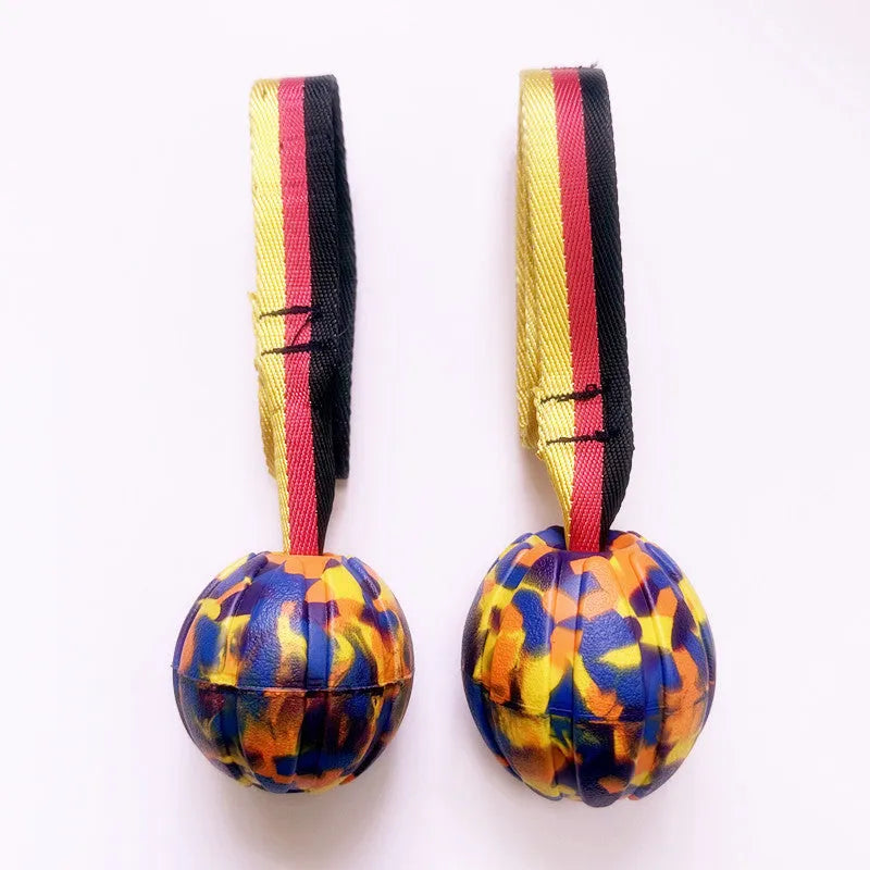 Camouflage and yellow EVA floating dog tetherball toys with string in 6.5cm, 7cm, and 9cm sizes.