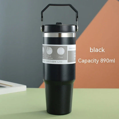 Insulated stainless steel travel tumbler with double-wall vacuum technology, sweat-proof powder coating, and BPA-free sliding lid for hot and cold drinks on the go.