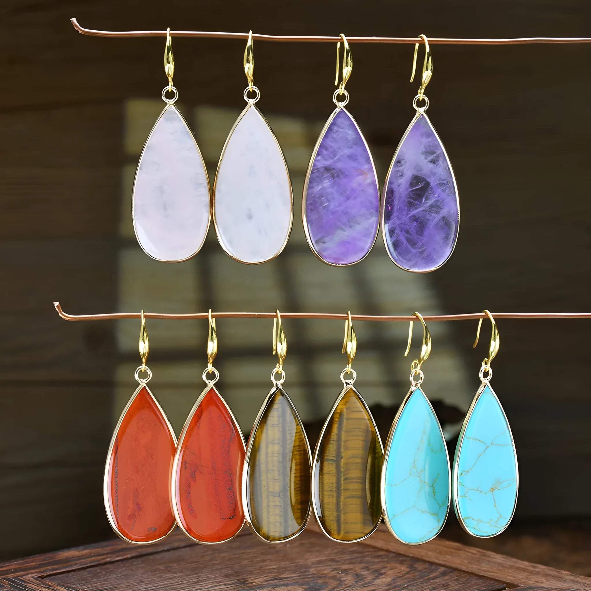 Vintage Tigereye long water drop stone earrings showing textured surface and elongated silhouette