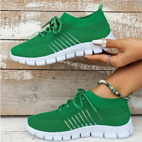Women's high-cut lace-up sneaker in a choice of colours, showing breathable upper and flat rubber sole.