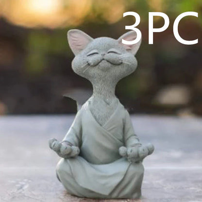 Charming ceramic Buddha cat figurine in black, grey, and orange colors for meditation, yoga, and home decor