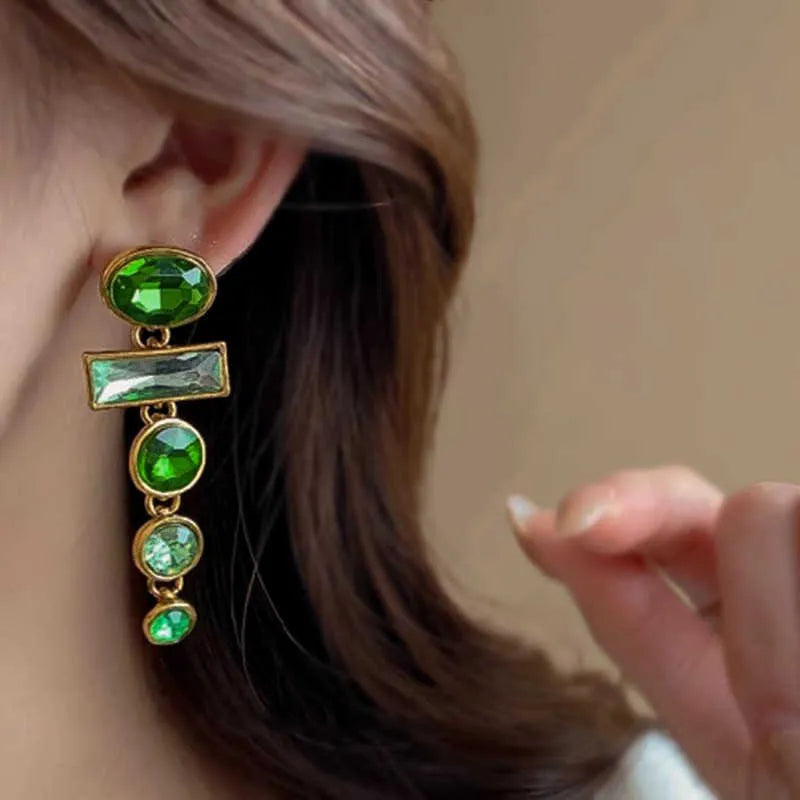 A pair of geometric-shaped green gradient earrings with zircon stones and a tassel, in a Chinese style.