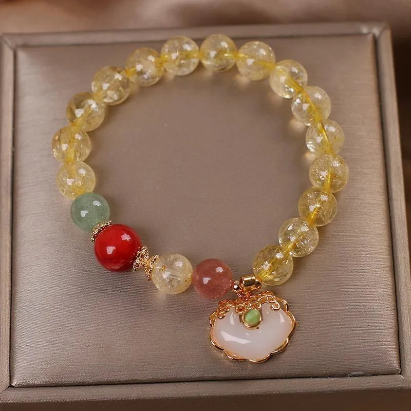 Women's alloy bracelet with a yellow natural citrine jade ruyi pendant.