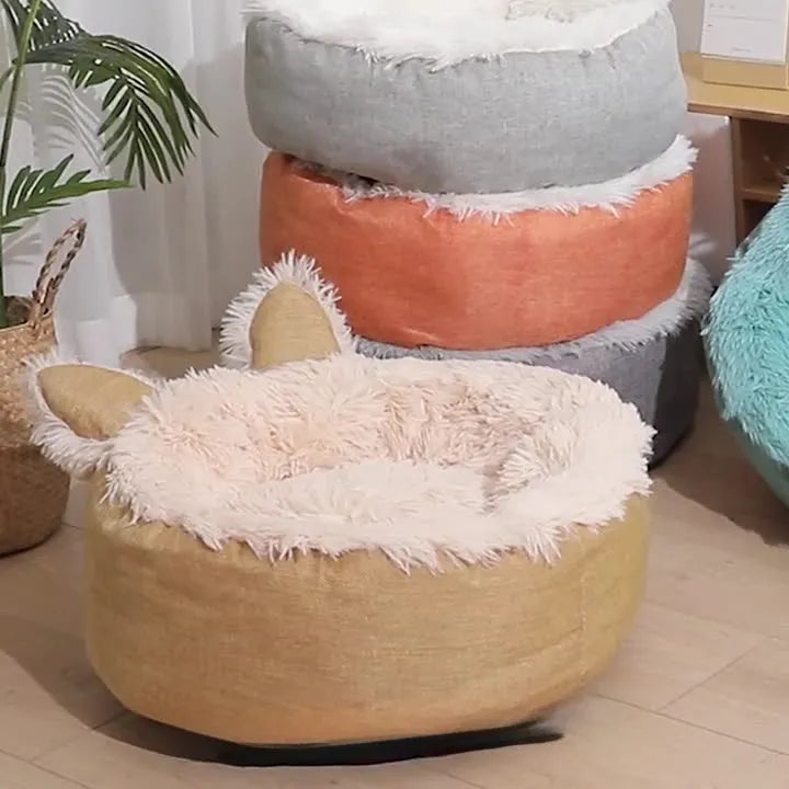 Blue faux fur plush enclosed cat bed house on a wooden floor
