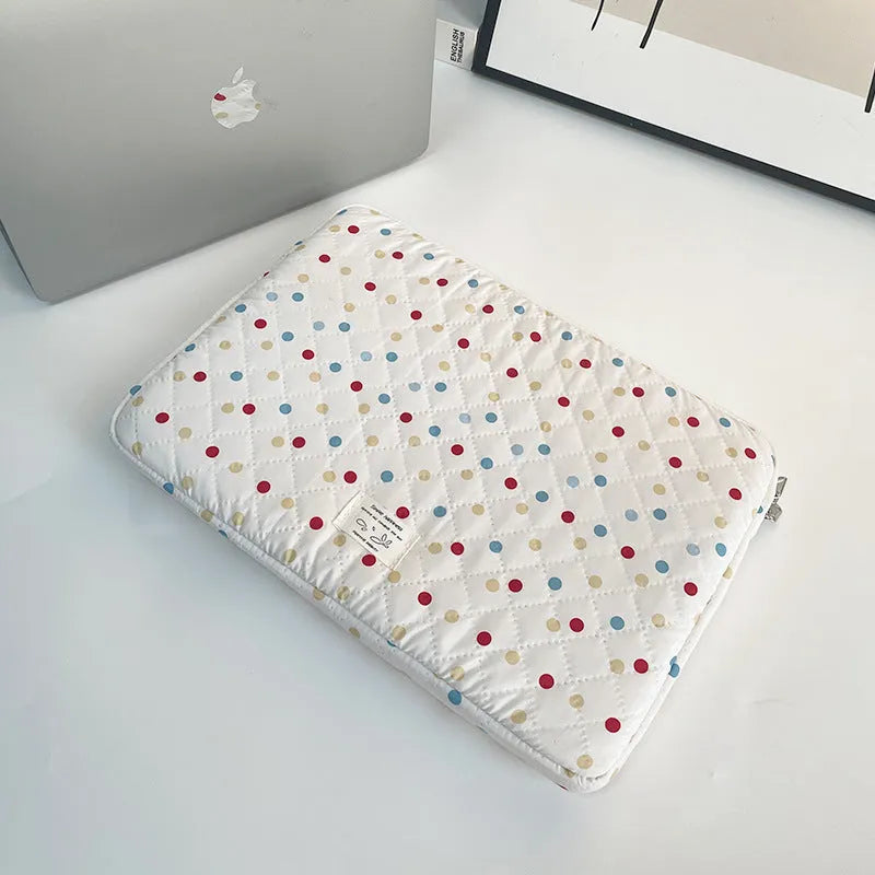 Women's polka dot polyester laptop bag shown in a solid colour, suitable for a 15.6 inch device.