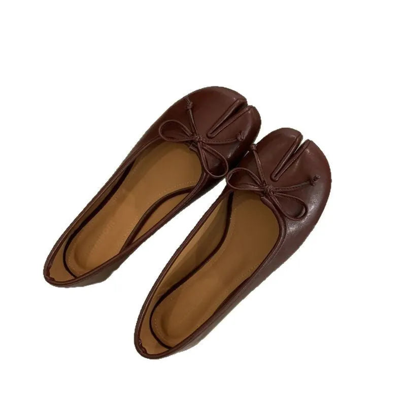 Women's split-toe flats in beige colour showing round toe design and slip-on style with shallow vamp cut