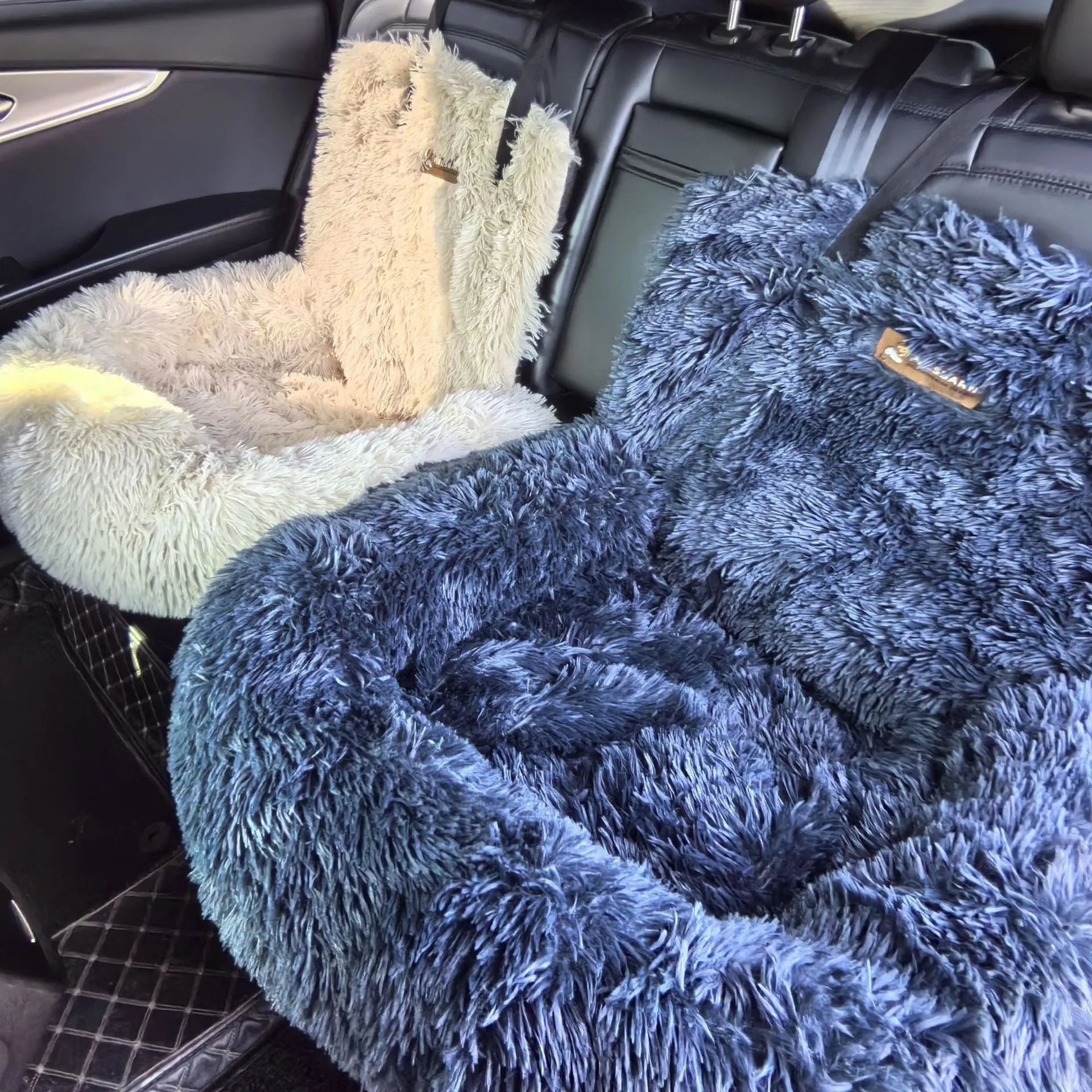 Beige thick cloth pet mat shown inside a car boot next to a dog.