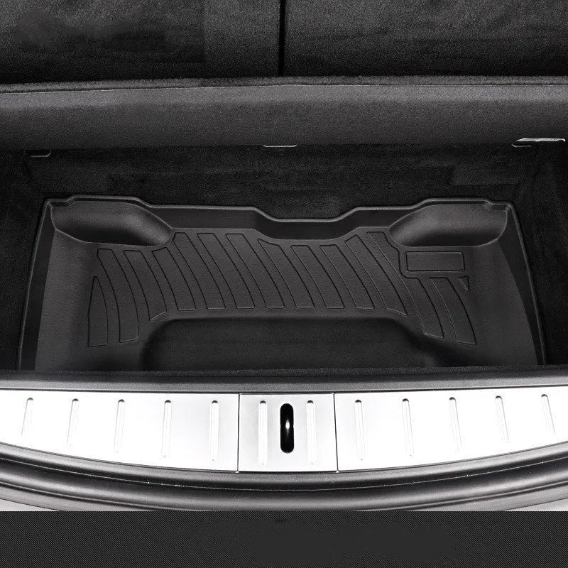 Rubber floor mat for Tesla car with TPE footrest section.