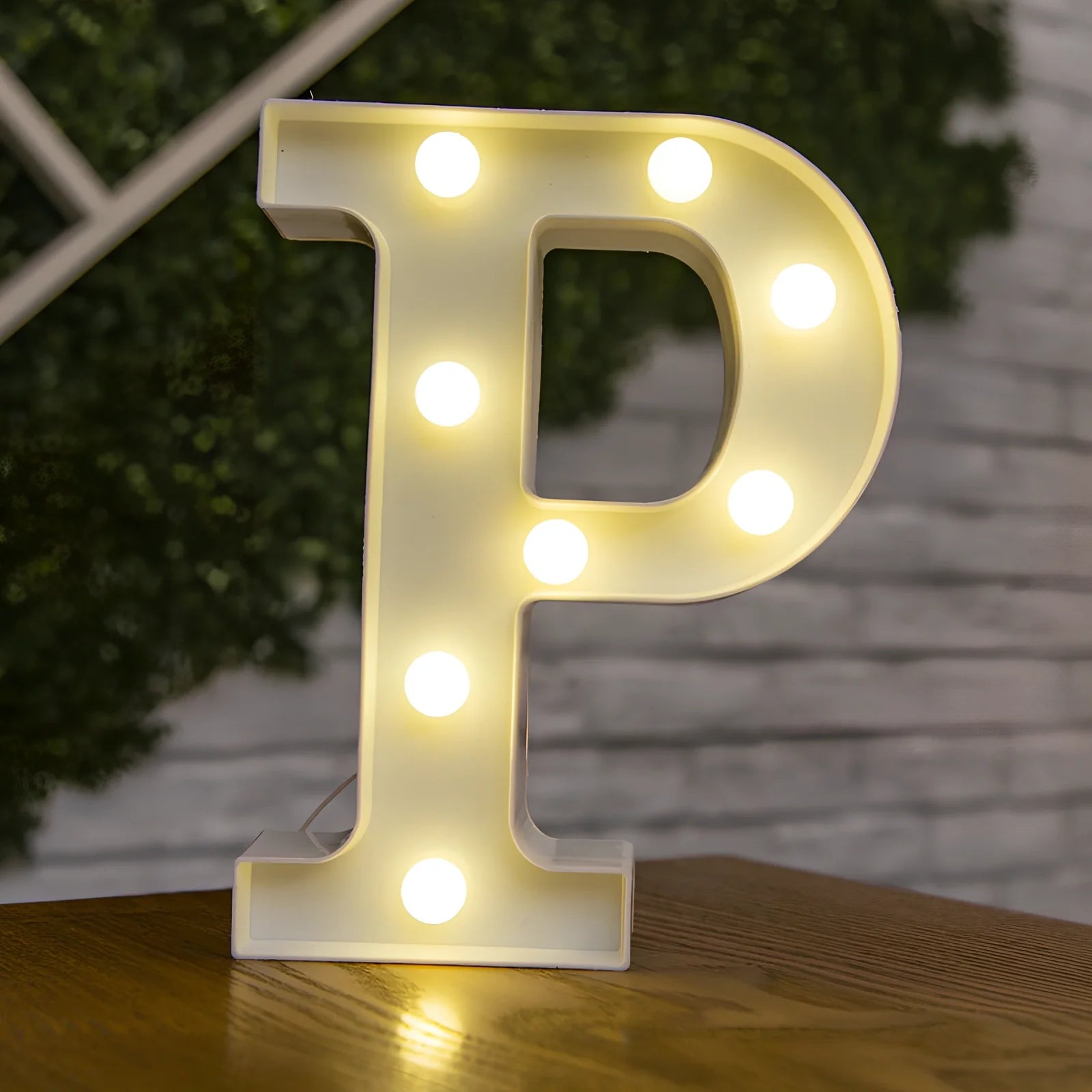 White plastic LED alphabet marquee sign with warm white illumination, 22cm height with battery operation