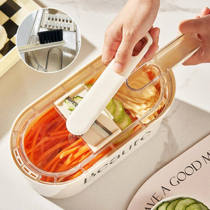 Versatile vegetable chopper with interchangeable blades, built-in container, and cleaning brush for easy meal prep