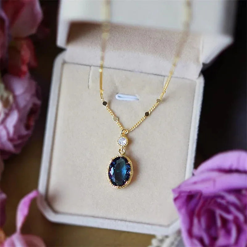 Gold geometric pendant necklace on a chain, French retro style.