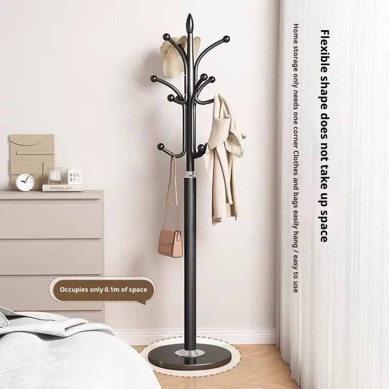 Floor-standing metal coat rack in black, vertical design for bedroom use, simple iron frame