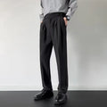 Men's straight-leg loose fit trousers in apricot colour on a hanger