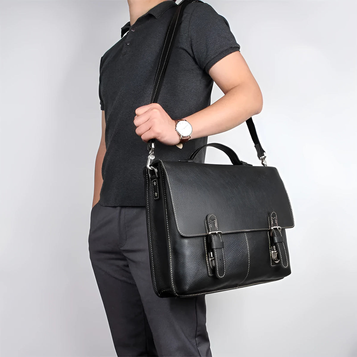 Men's retro brown leather business briefcase with adjustable shoulder strap, 38cm length, holds a 15.6-inch laptop.