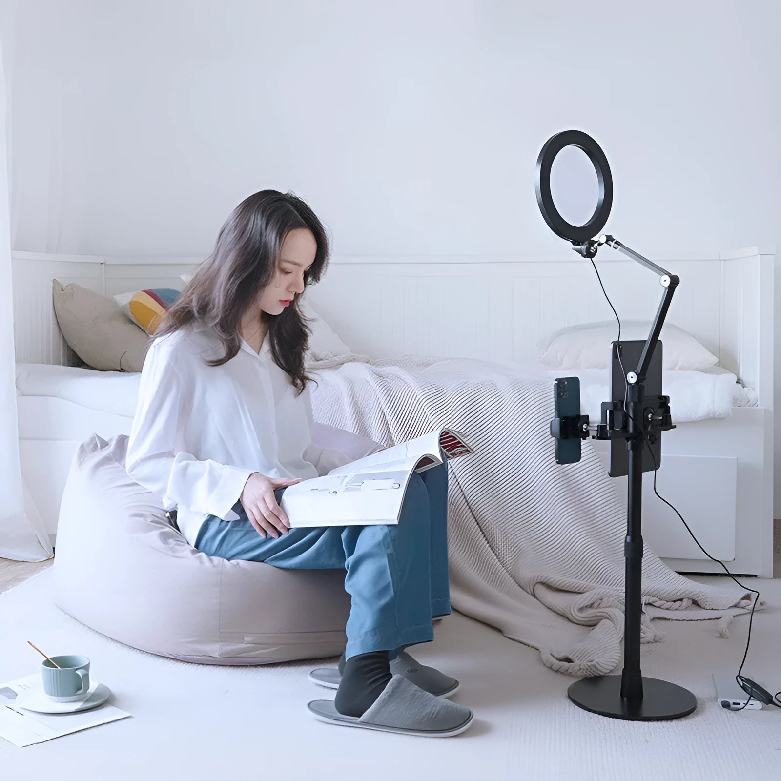 Black floor-standing phone tablet stand with two LED fill lights in vertical folded position