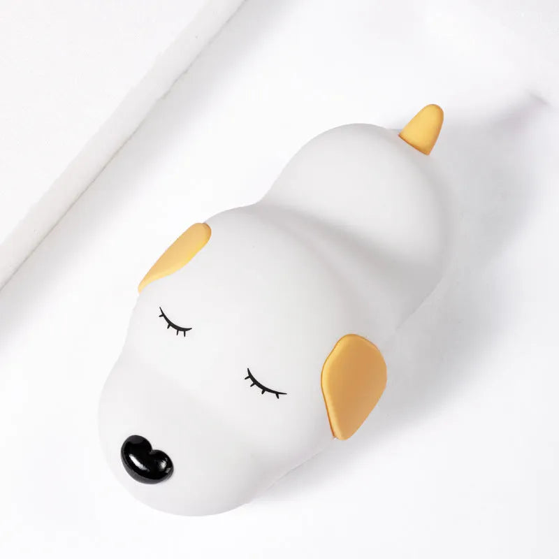 Silicone cartoon dog night light with two-colour design, powered by a USB cable.