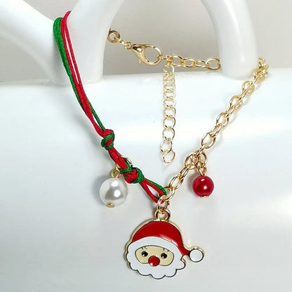 Christmas charm bracelet with snowman, Santa Claus, and snowflake designs