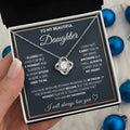 Silver metal four-leaf clover hollow jeweled pendant clavicle chain on display with geometric shape and card beside flip gift box