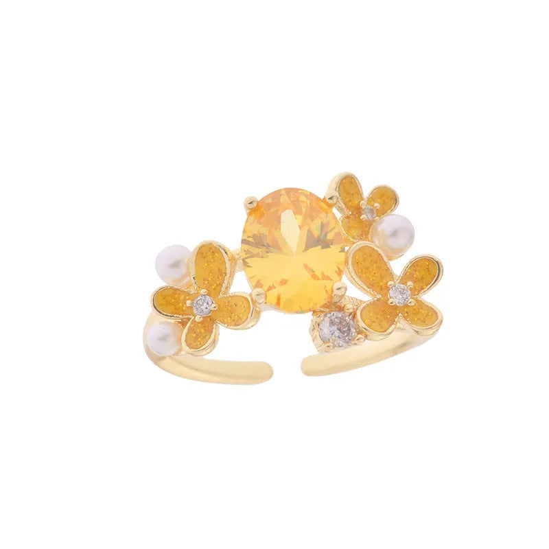 Women's open ring with flower design and zircon detail in light purple or yellow colour options