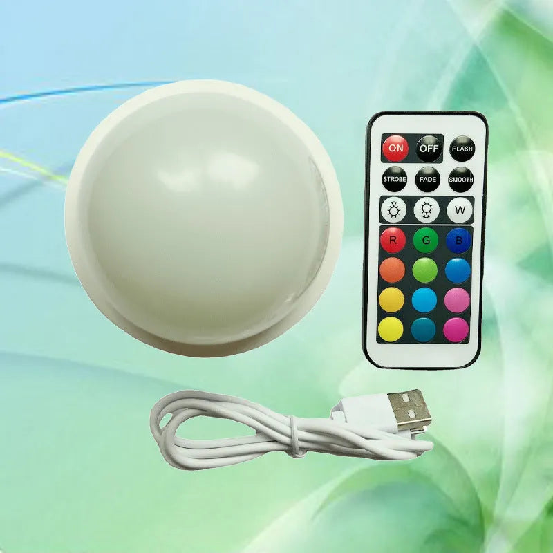 Colourful gradient 3D shooting night light with USB cable, touch panel, and remote control.