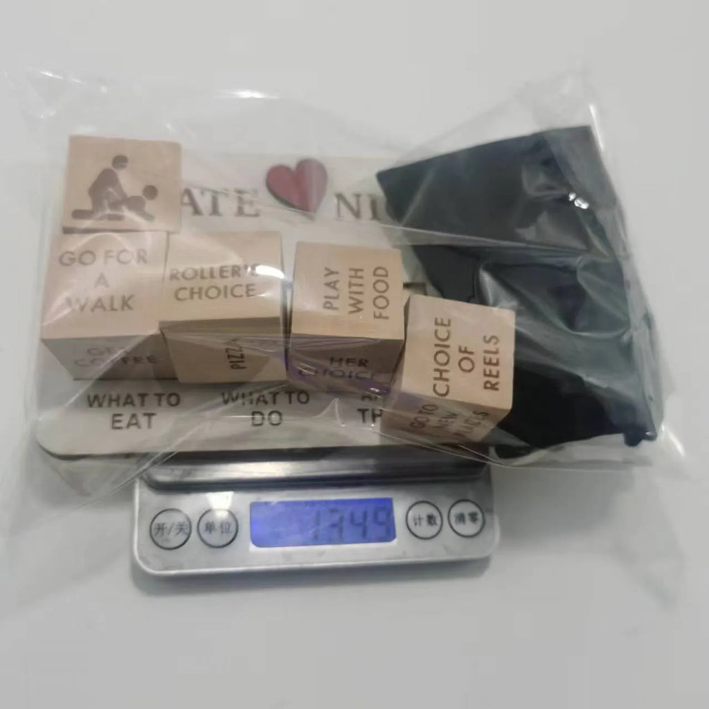 Wooden date night dice game set showing five dice, a rectangular wooden board, and a black fabric storage bag.