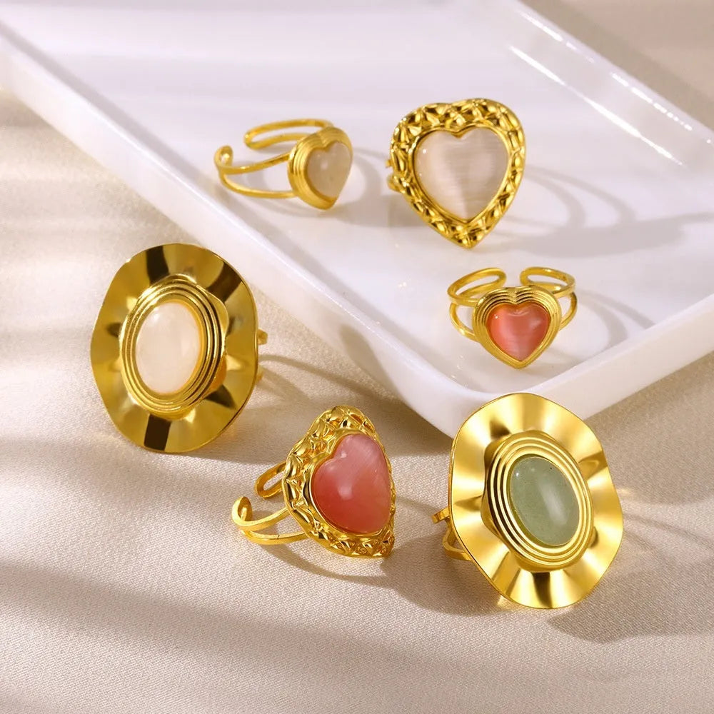 Retro stainless steel heart-shaped pendant ring with adjustable open band and electroplated finish, white background
