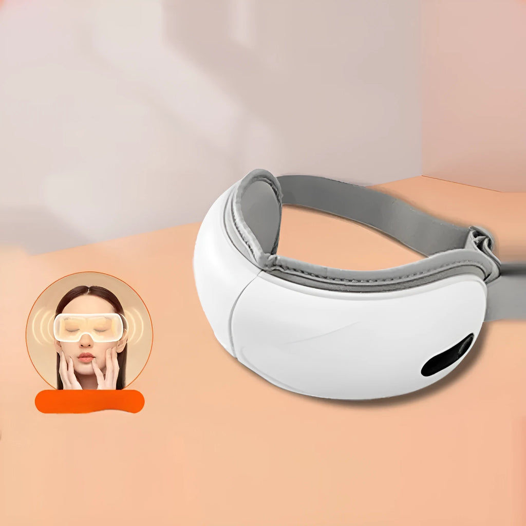 White rechargeable airbag massage eye massager with hot compress function on grey background
