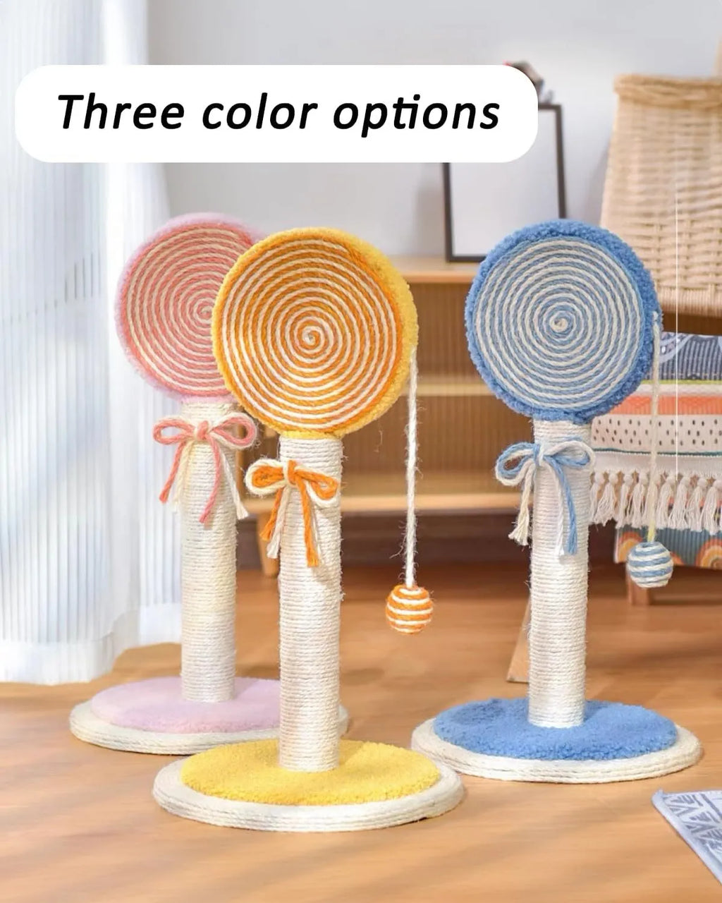 Blue cat scratching post with sisal rope and a hanging yellow ball on a sturdy square base.