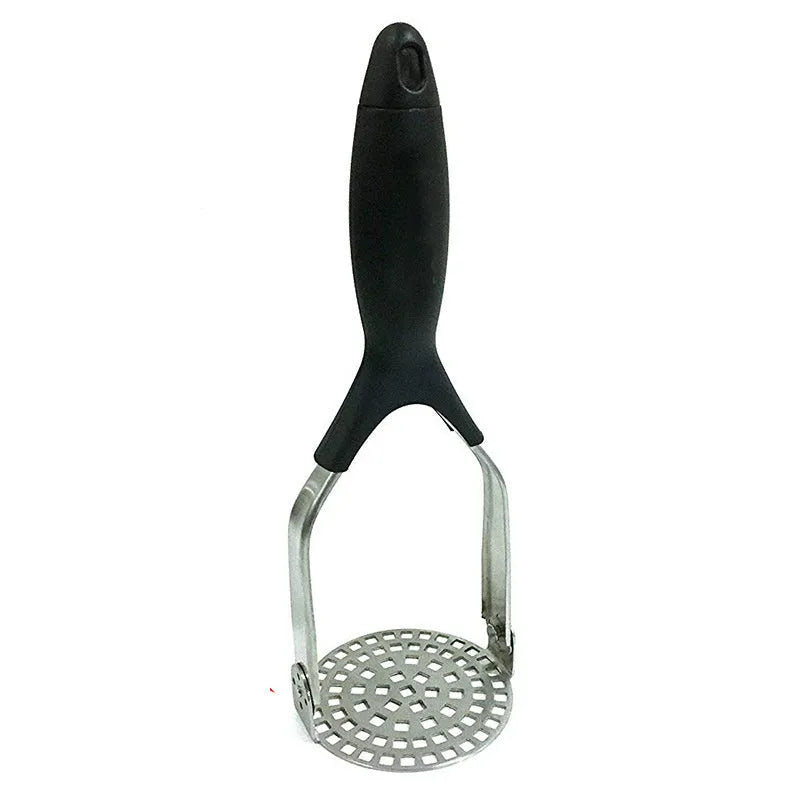 Manual potato masher with wooden handle and flower-shaped iron plated press head on a light surface