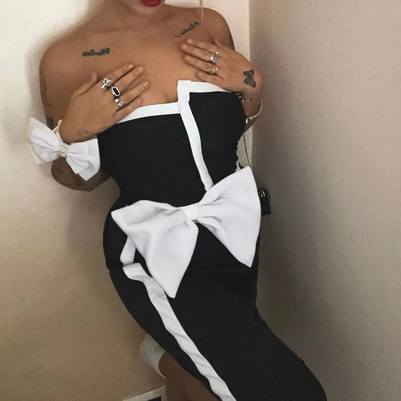 Women's black and white colour-block one-piece swimsuit with asymmetric bow and irregular tube top