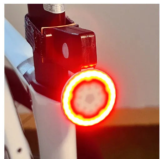 Rechargeable cartoon bicycle taillight in flower shape with flashing two-colour LEDs