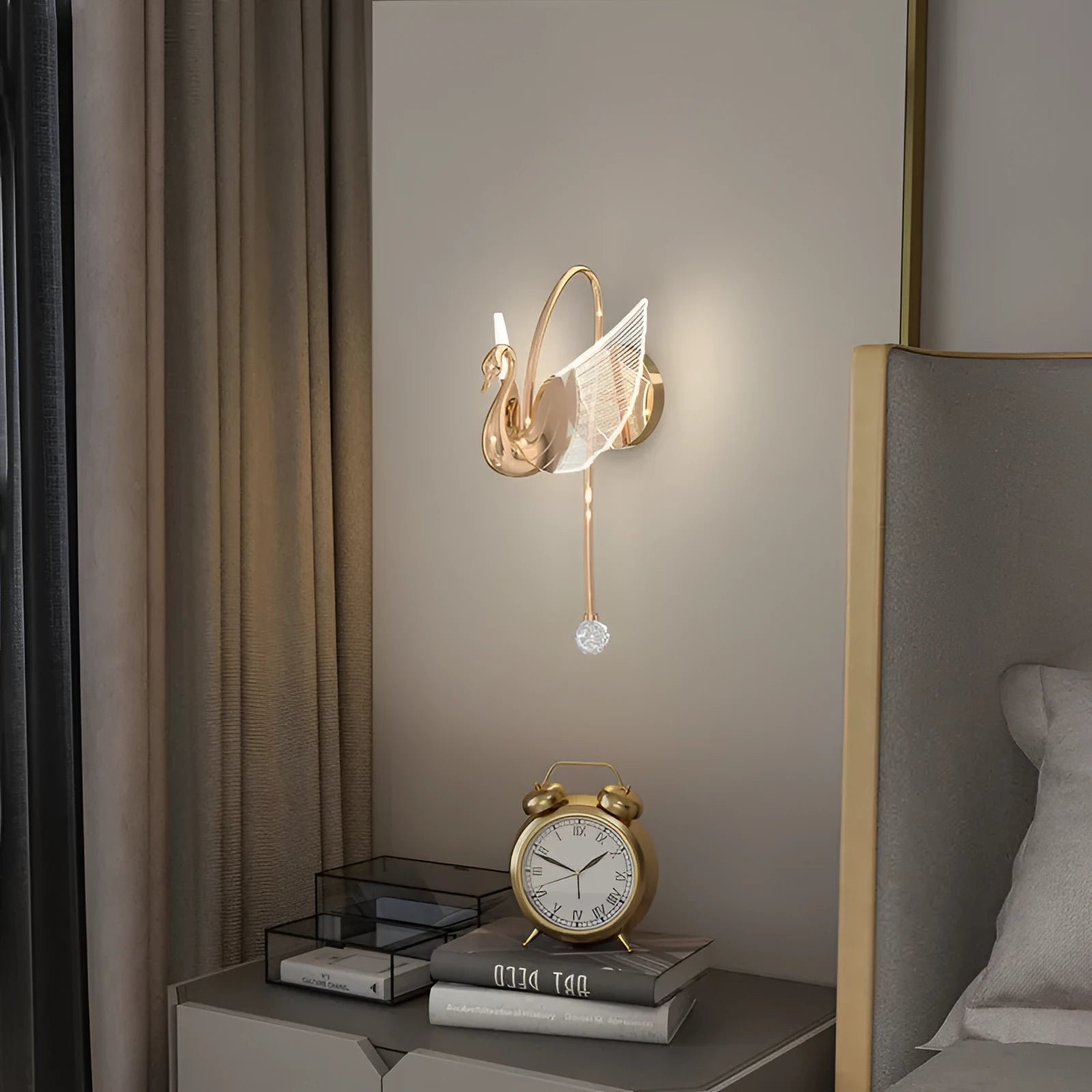 Modern minimalist gold swan-shaped wall lamp with an acrylic shade and LED light.