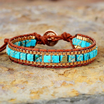 Hand-woven leather bracelet with blue imperial stone accent, geometric design