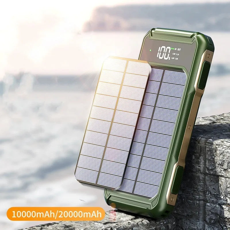 Black, green, and orange coloured large capacity military-grade mobile power bank showing size scale.