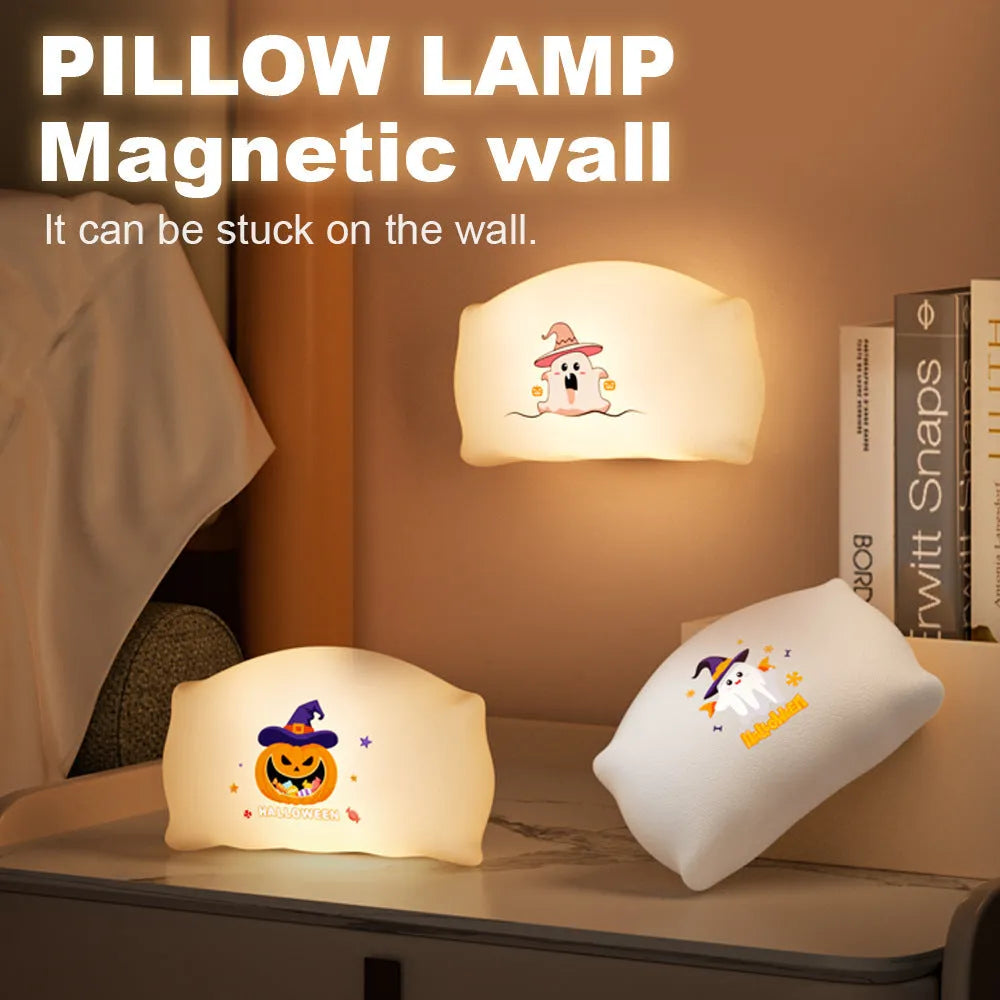 Cartoon Halloween ghost or pumpkin doll table lamp with warm white LED light on a table.