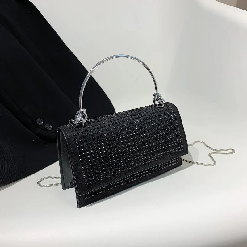 Small square chain crossbody bag for women with rhinestones in silver and black, PU construction with crossbody strap