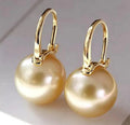 Women's 18K champagne gold pearl earrings with Seiko finish, retro U-shaped design on white background