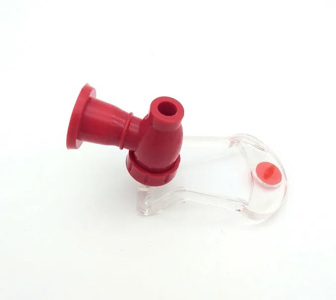 Red plastic Magic Tap soda dispenser for 2-liter bottles with push-button mechanism