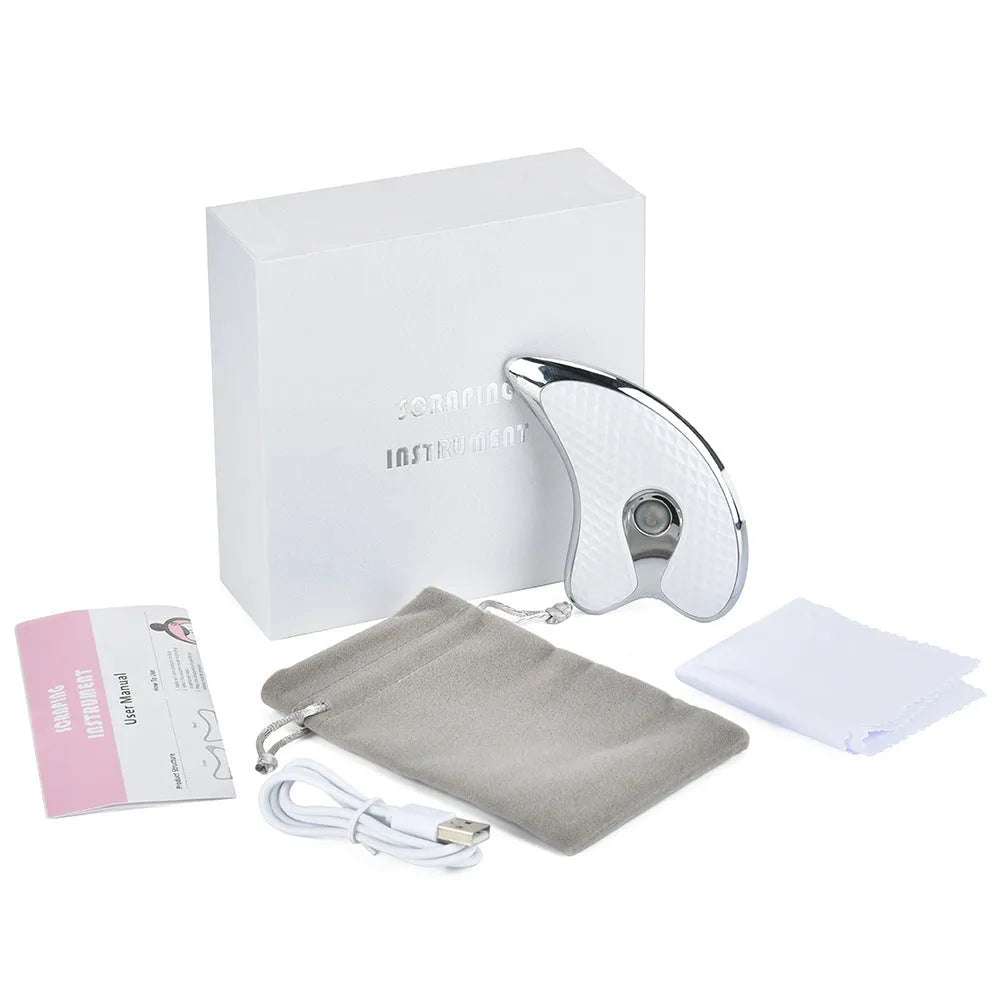 White rechargeable vibrating facial massager scraping board with ergonomic handle on a clean background