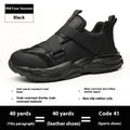 Black safety work shoes with steel toe caps, buckle fastening, and mesh uppers showing protective features