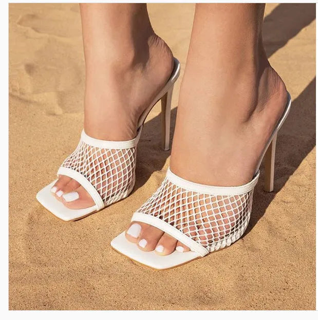 Women's white fish mouth sandals with leather insole and side air detail, side view