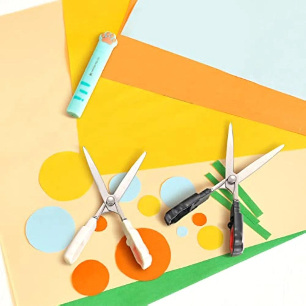 Set of four colourful mini folding scissors with cat paw handles on a white background.